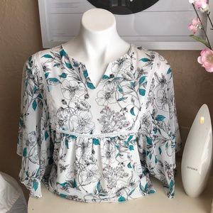 Flowing blouse with turquoise flowers